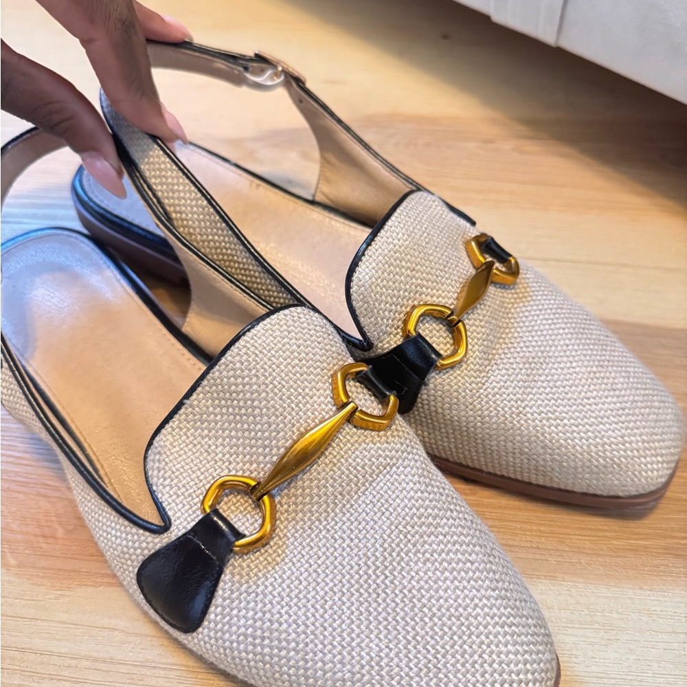 Chic Cream and Black Loafers with Gold Accents